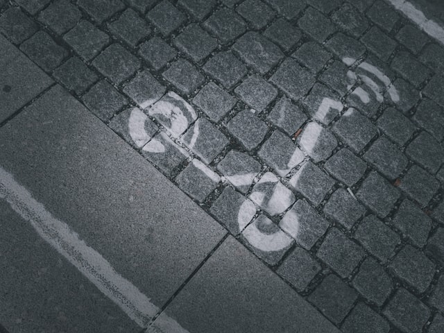 scooter stencil on paved road Electric scooter charging station